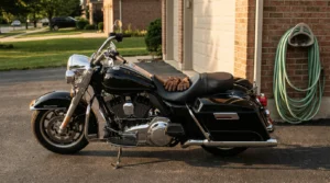 Harley-Davidson touring motorcycle parked in driveway with leather gloves on seat