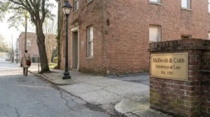 McDevitt & Cobb Attorneys at Law Est. 1981 sign on brick building exterior